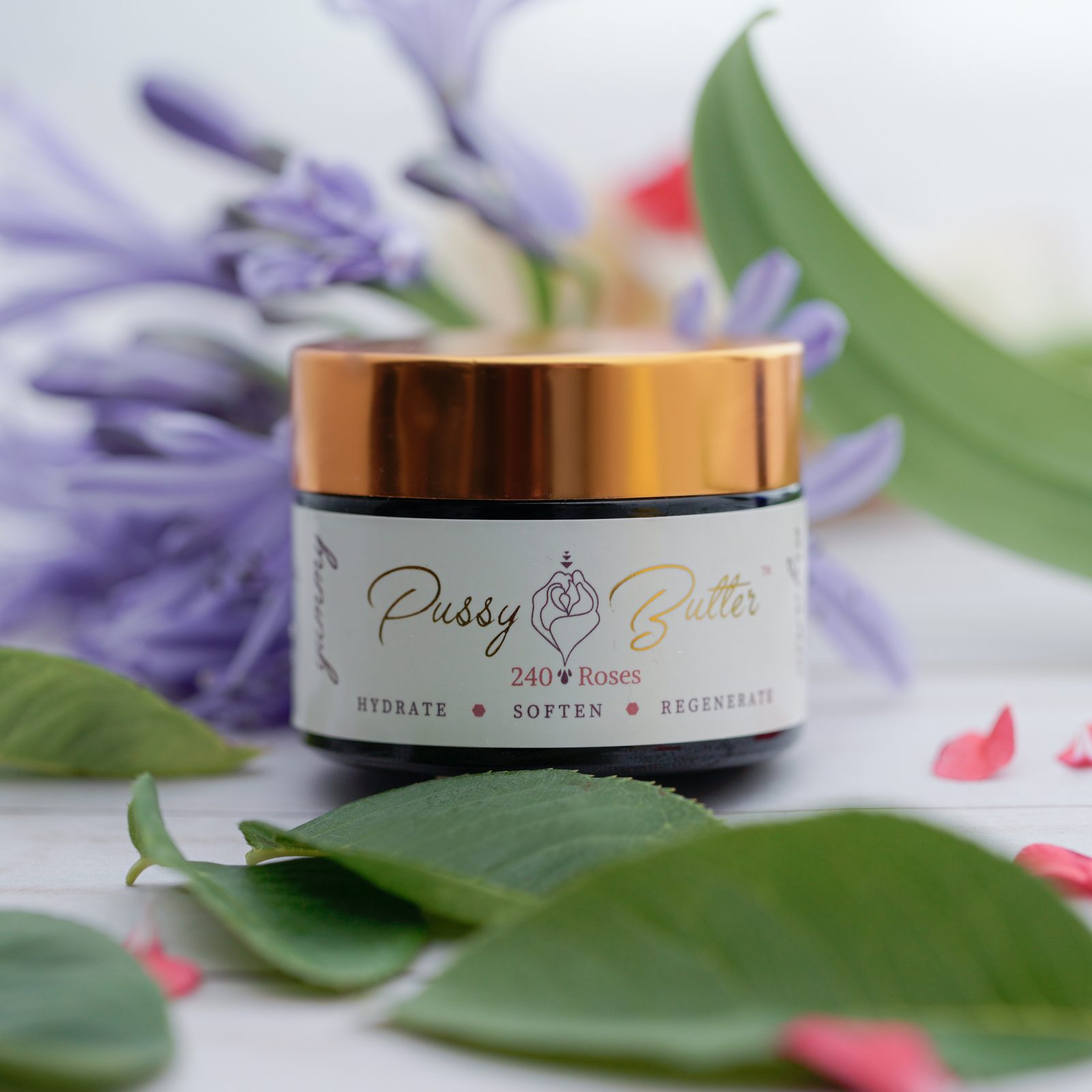 Pussy Butter™ jar with agapanthus blooms and soft pink petals