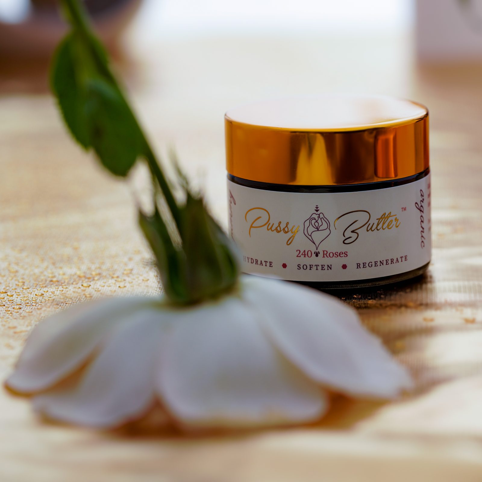 Pussy Butter™ jar with a delicate white flower